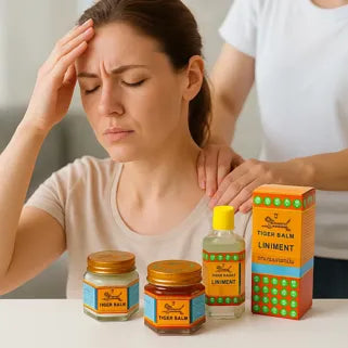 Femme souffrant de maux de tête, utilisant le baume du tigre pour soulager la douleur.