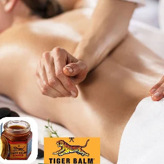 Massage relaxant à l'aide du baume du tigre rouge