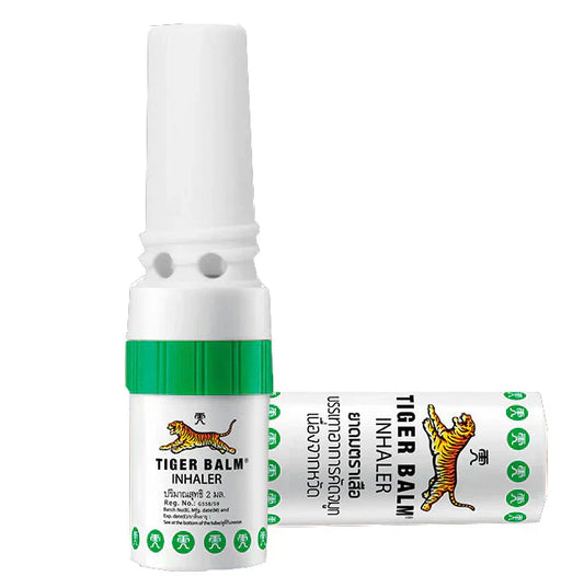 Inhalateur Tiger Balm, tube blanc et vert, offrant un soulagement nasal, rafraîchissement et arômes naturels.