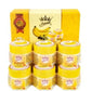 Coffret Supreme contenant plusieurs pots de baume hydratant à la banane, présenté avec un packaging jaune orné d’un logo couronne. L’image met en avant un soin nourrissant pour réparer la peau sèche et craquelée, soulignant son statut de best‑seller et sa formule enrichie.