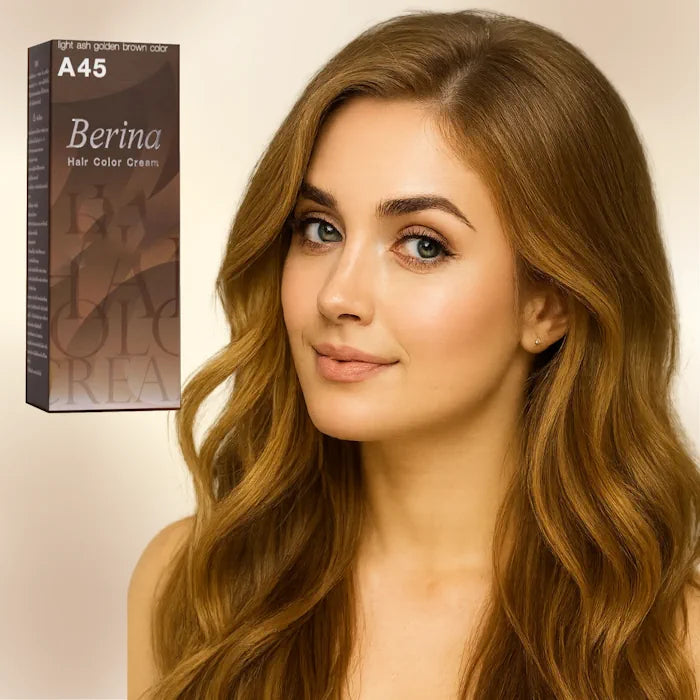 Jeune femme aux cheveux châtain doré clair cendré, posant à côté d'une boîte de teinture Berina A45.