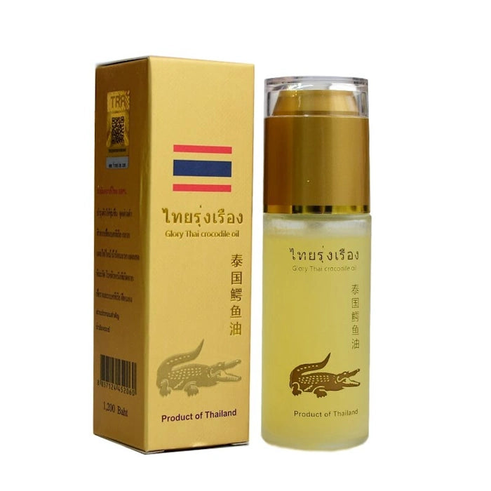 Bouteille et boîte d'huile de crocodile Glory Thai pour les douleurs articulaires et l'acné.