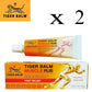 Emballage de la crème Tiger Balm Muscle Rub. Tube et boîte orange et jaune, indiquant 'TIGER BALM MUSCLE RUB'.Lot de 2