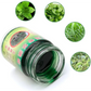 Un pot ouvert contenant une pommade verte à base de plantes est entouré de cinq images de végétaux. L'étiquette en chinois suggère une composition 