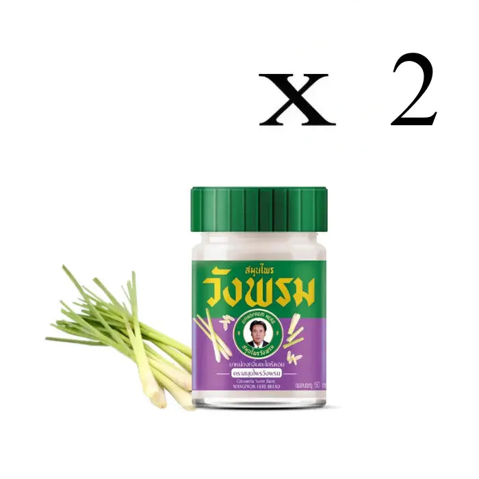 2 Pots de baume Wangprom Herb avec un couvercle vert et une étiquette vert et violette. L'étiquette mentionne 'Citronella Scent Balm' et affiche des images de citronnelle. Texte en thaï et en anglais